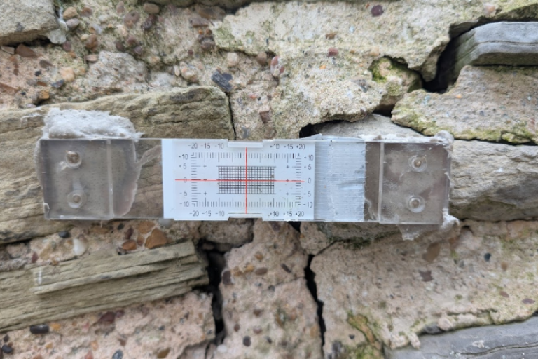 Crack monitoring gauge fixed across a vertical crack in the stone chimney stack at Newark Castle.
