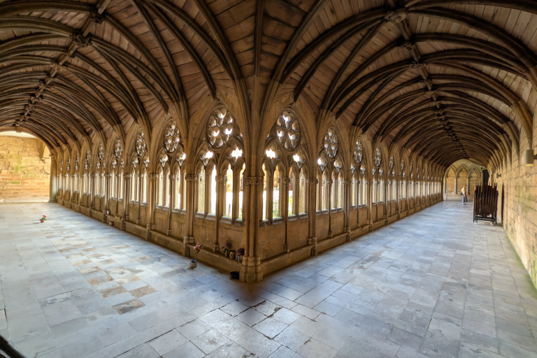 Old cathedral corridors leading away from each other symetrically
