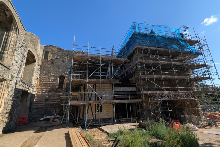 Castle under construction with scaffolding over the structure