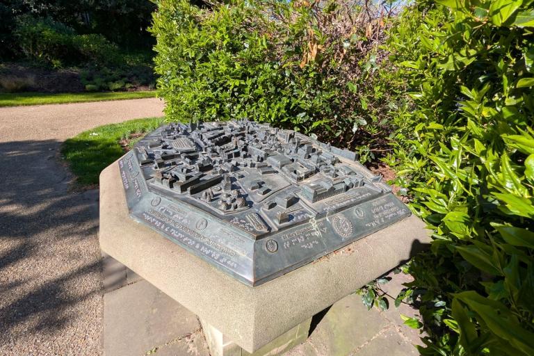 Bronze tactile map with raised features, braille and engraved text.