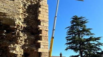 Crane lifting steel beams into place on the first floor of Newark Castle Gatehouse during restoration work.