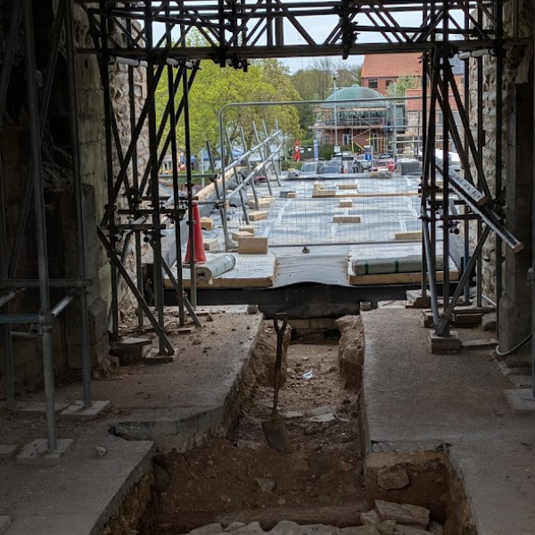 view looking out of the Gatehouse to the new stairs, showing the mortar cap over the well found inside the Newark Castle Gatehouse
